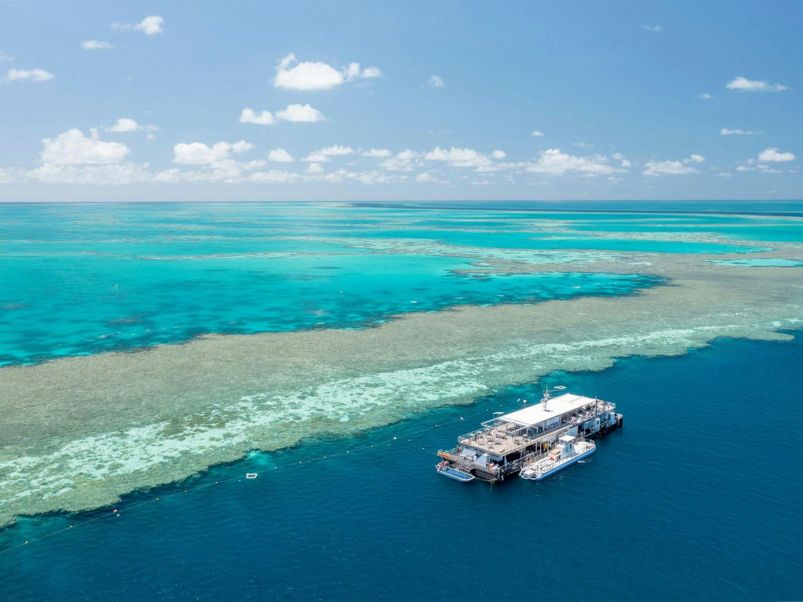 Aerial view of the Great Barrier Reef with a view of the Reefworld pontoon