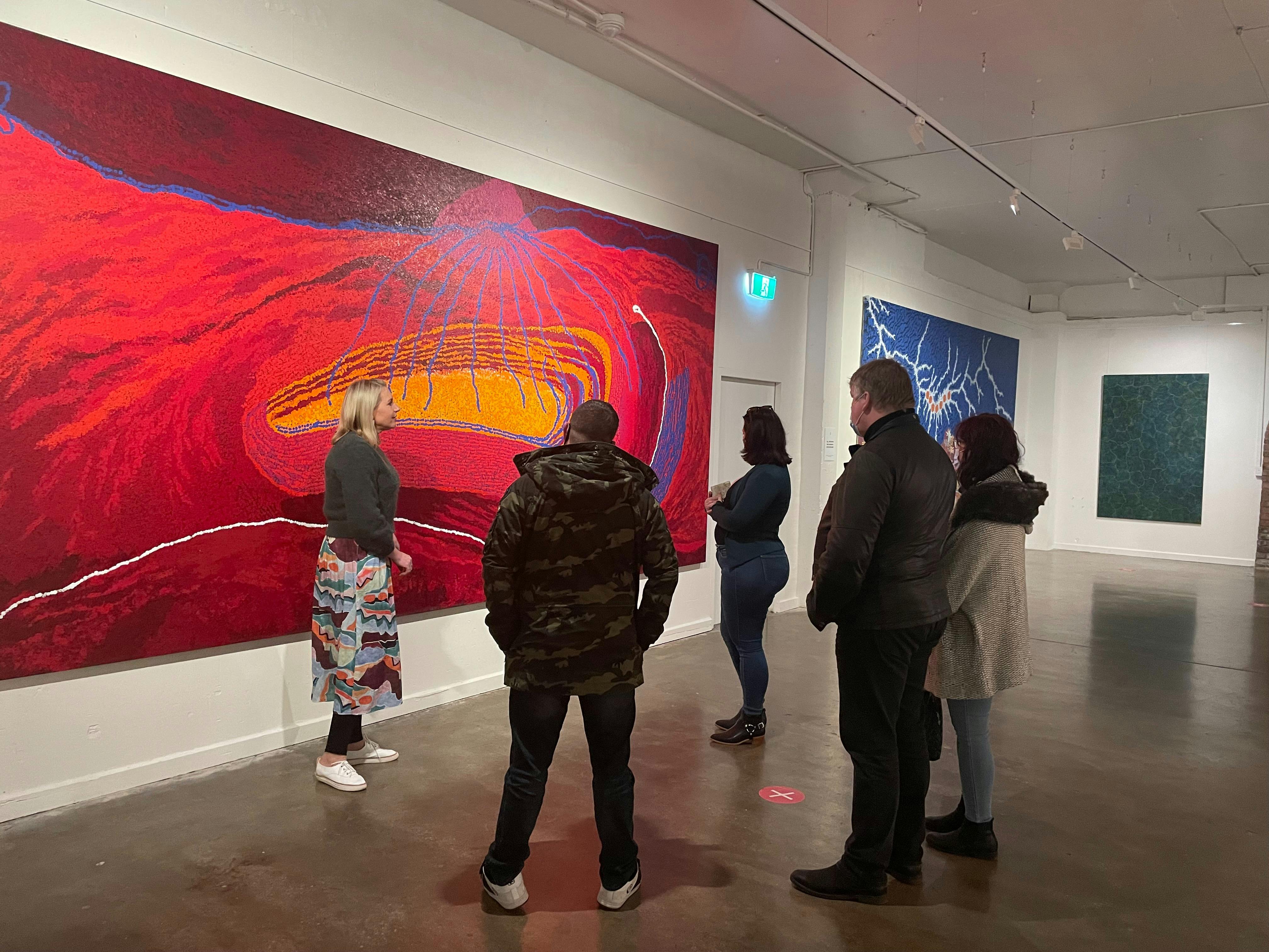Rambling Tour group admiring Aboriginal Art work at the Mitchelton Gallery