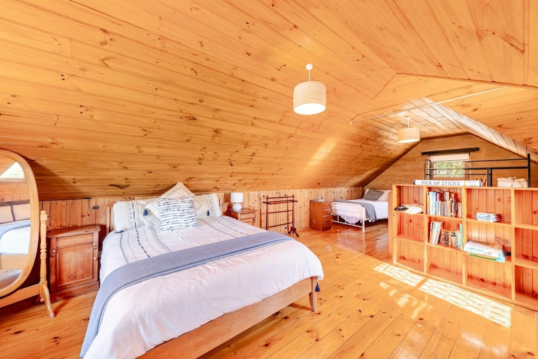 A large, open sleeping area with several beds.