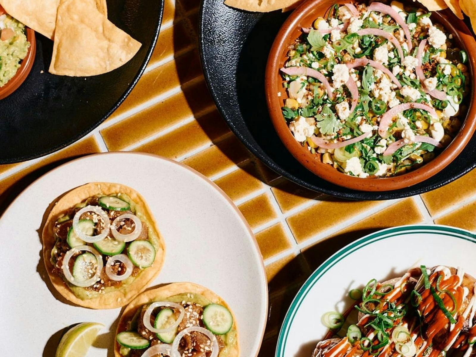 Mexican share plates on brown tiled table