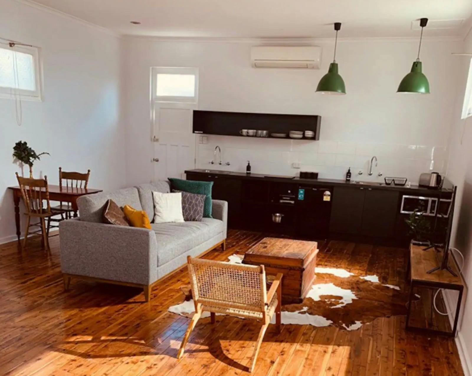 lounge room with sofa and chairs