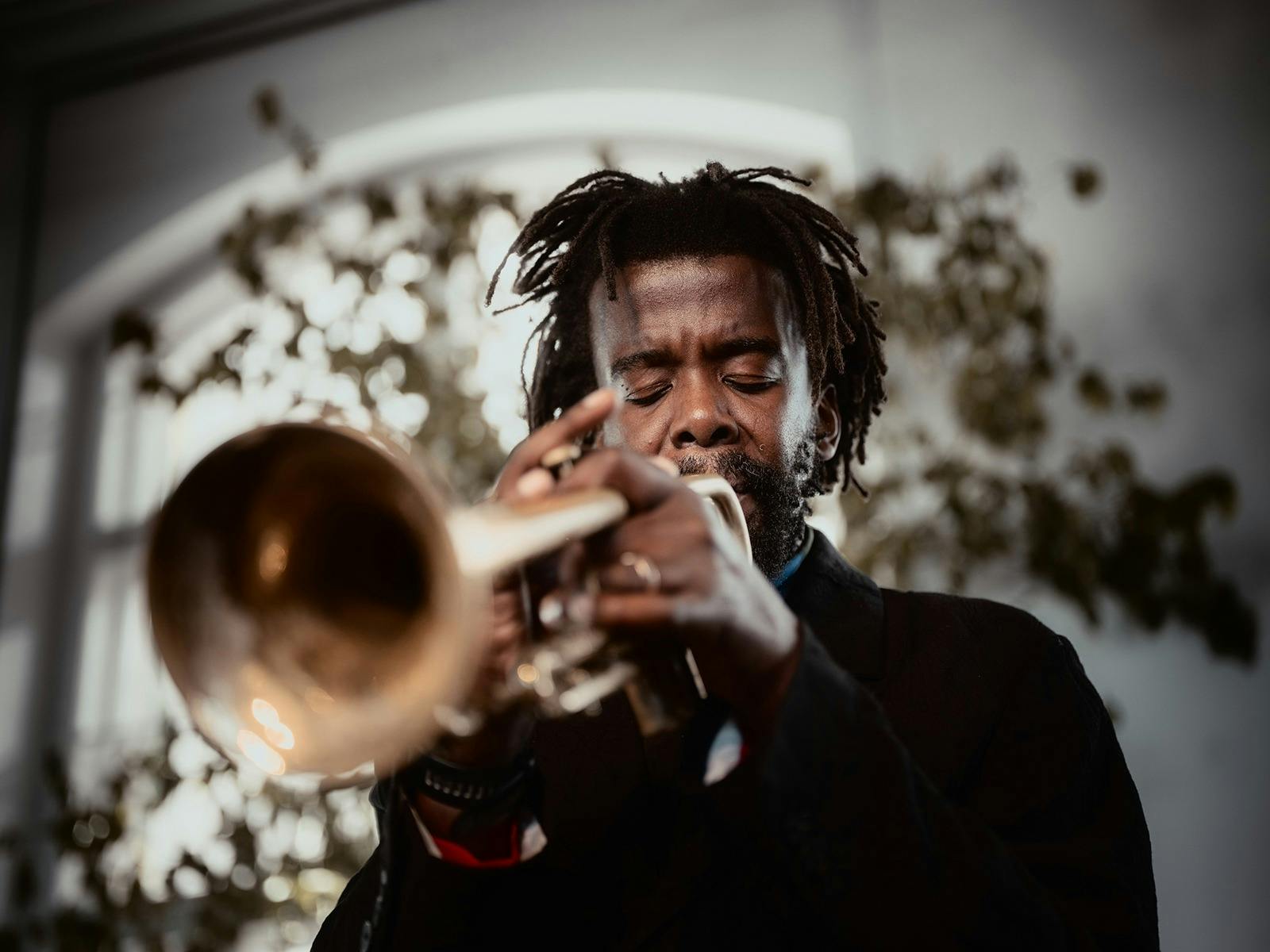 An artist playing a trumpet, shot with a close-up lens