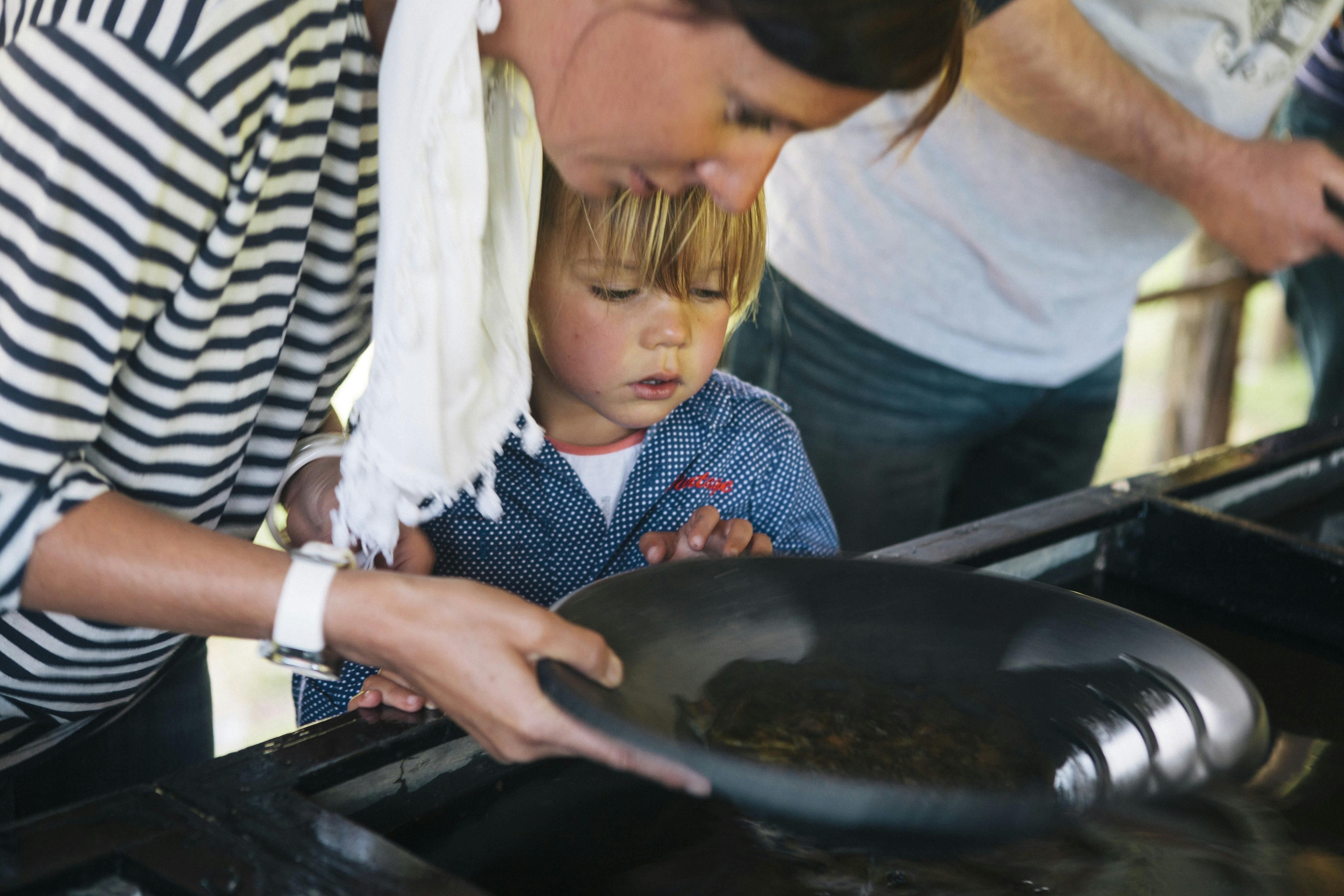 Child and parent pan for gold at Lynchford Station