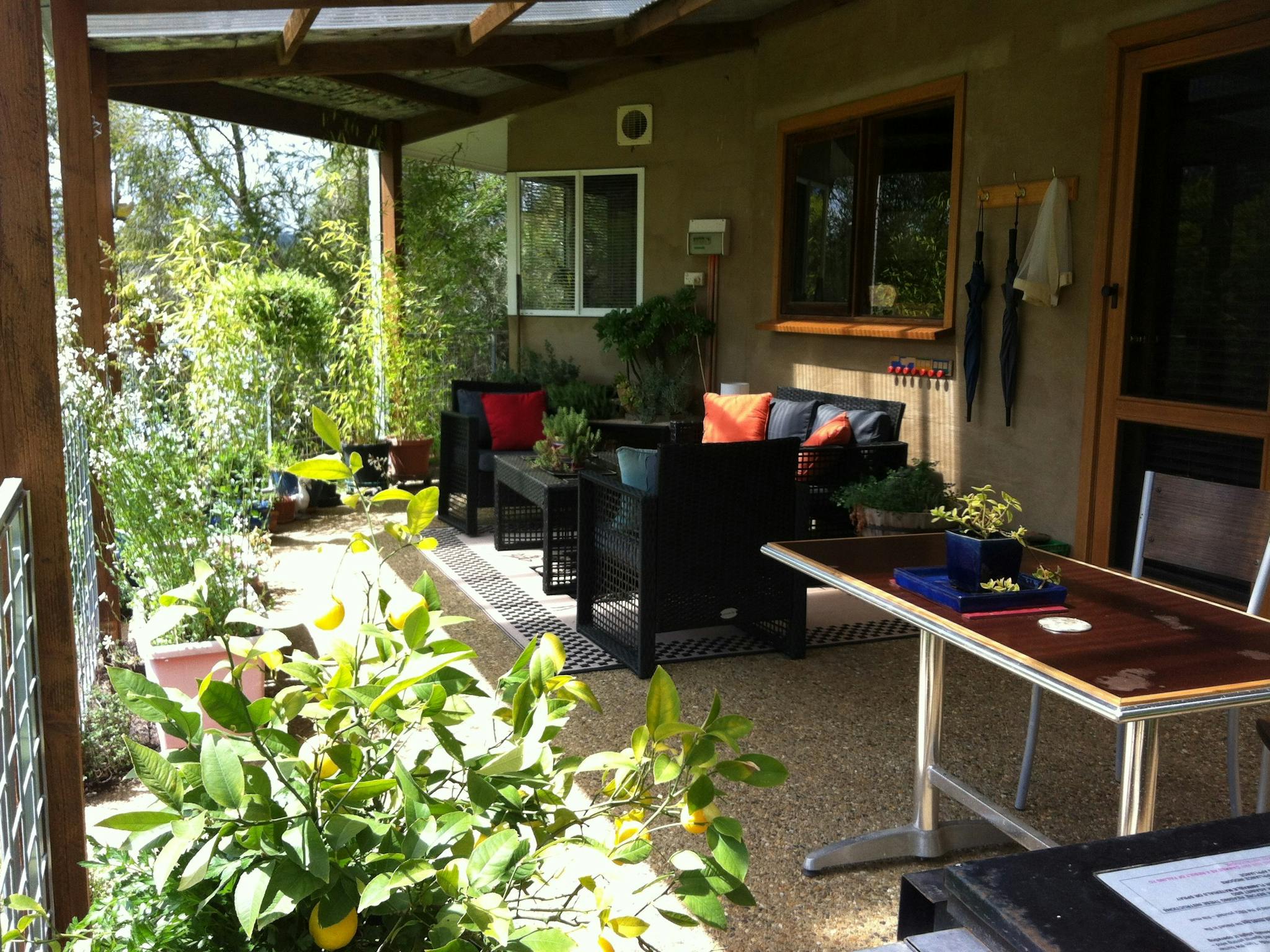 Covered outdoor lounge/dining area.