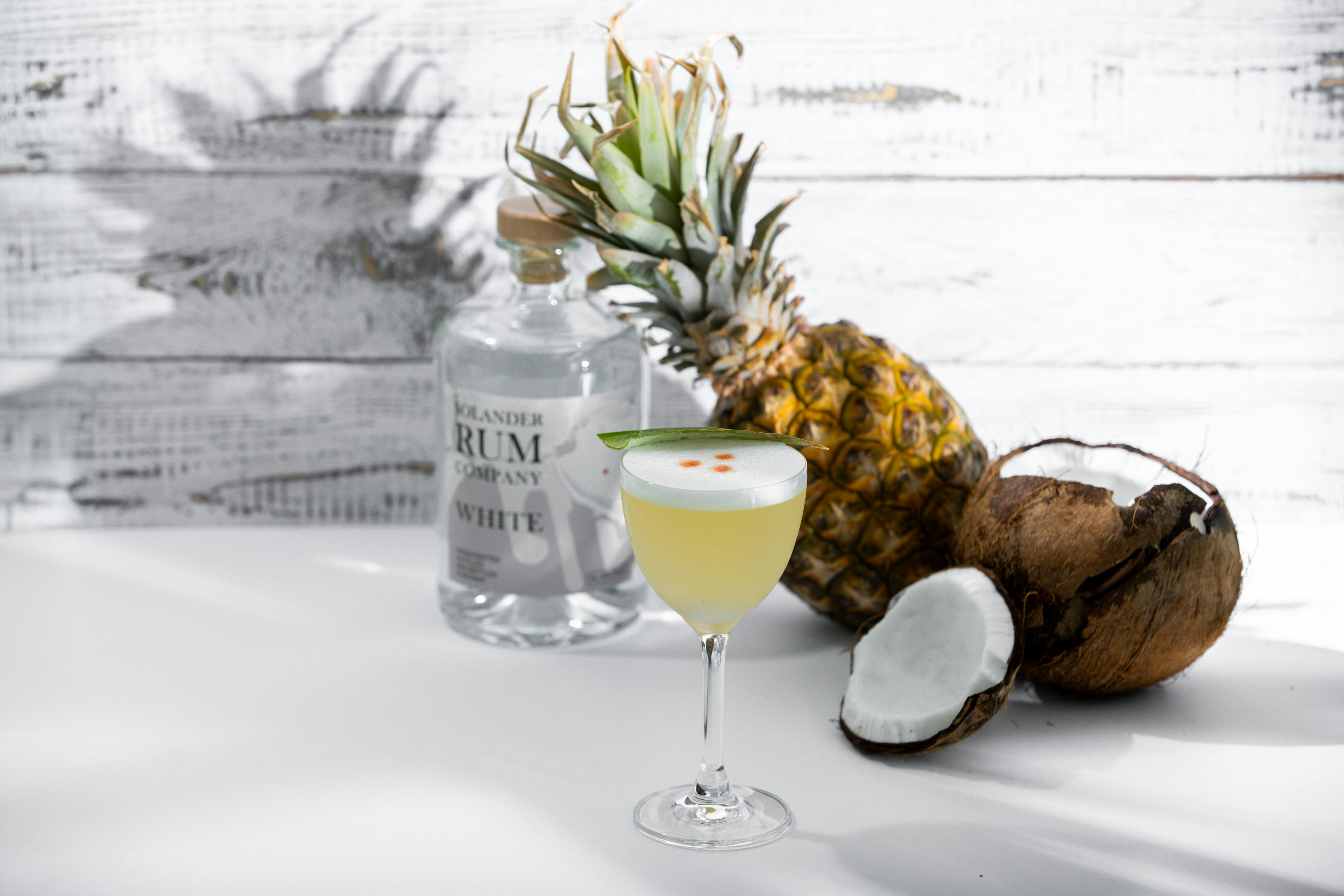 Pina Colada with bottle of White rum and coconut and a Pinapple