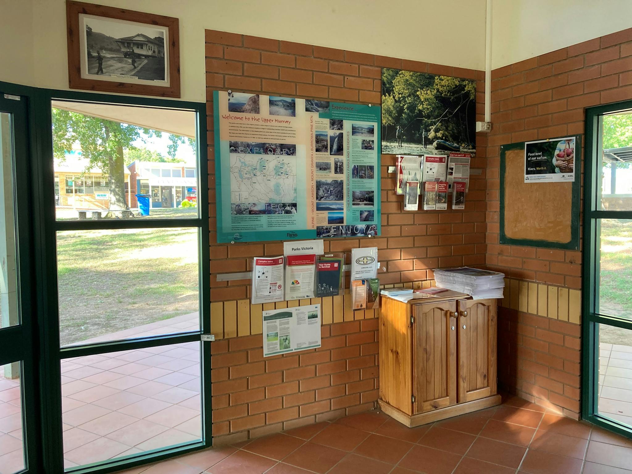 Inside the Tallangatta Visitor Information Centre showing out the glass windows and the parks info