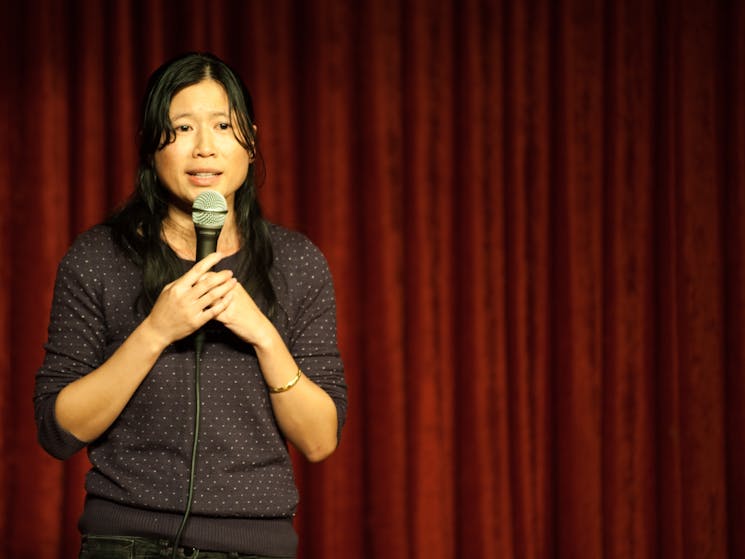 Comedian thao doing a comedy gig in Sydney