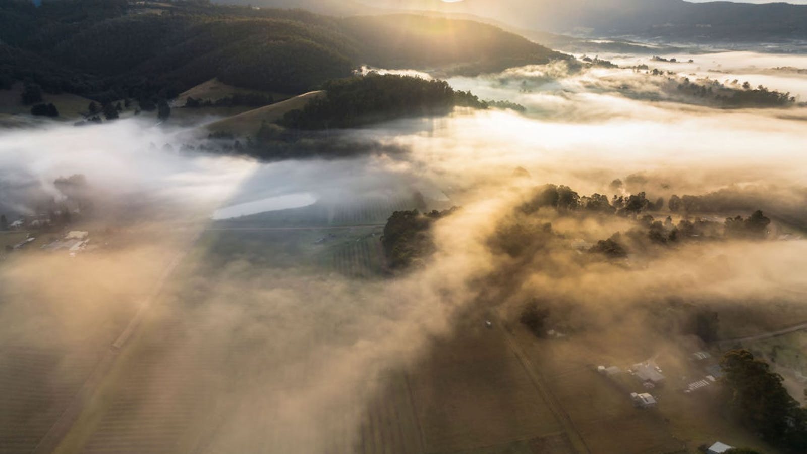 Overlooking valleys, mountains and orchards, dreamy mountain wisps twirl through