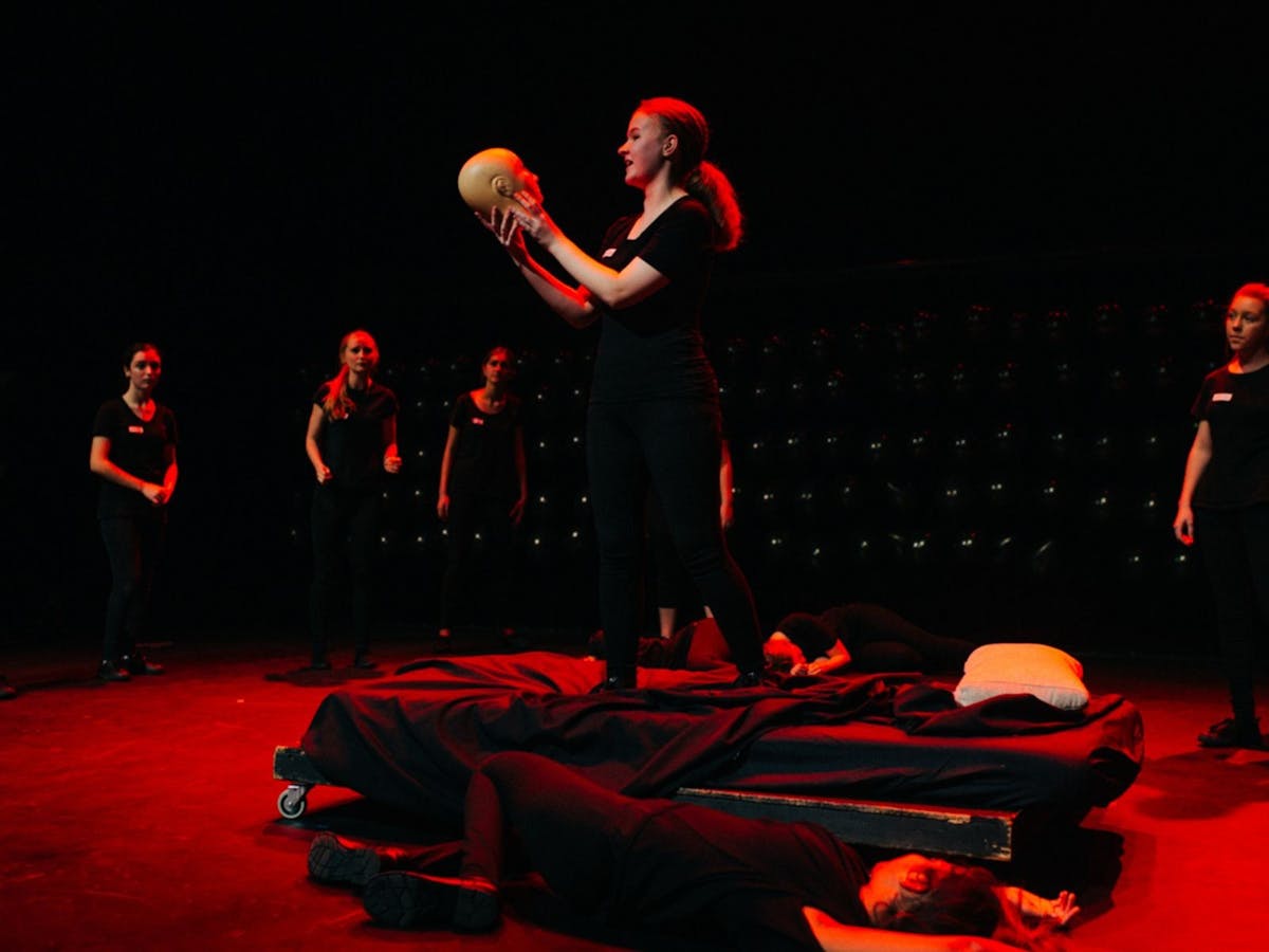 Adults perform soliloquy from Hamlet
