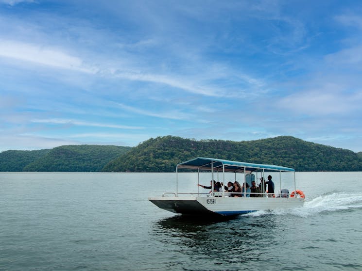 Visitors aboard 'Rose' with guide visiting the pearl leases and learning about pearl farming