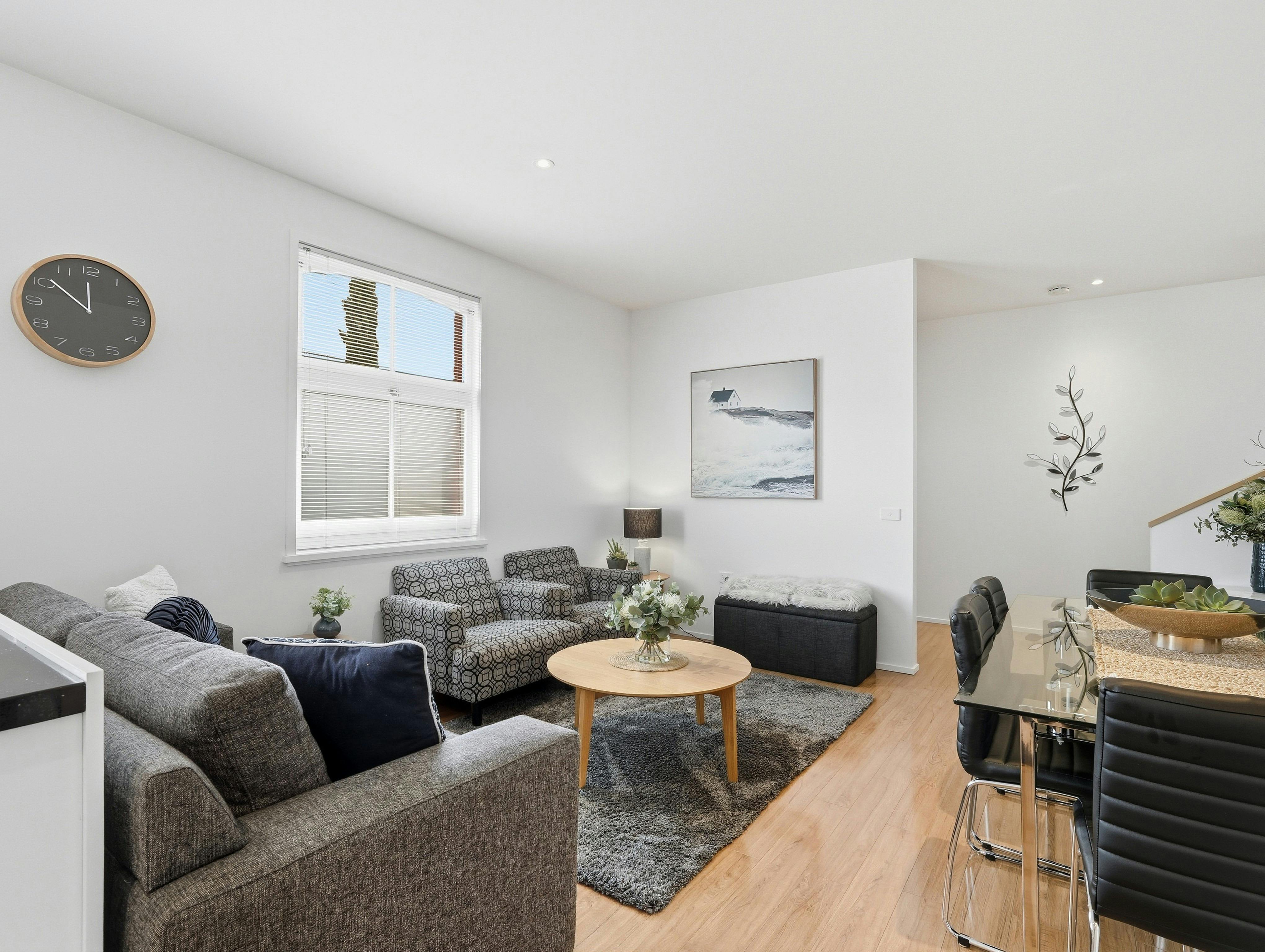 Comfortable open-plan living area with modern furnishings and dining space