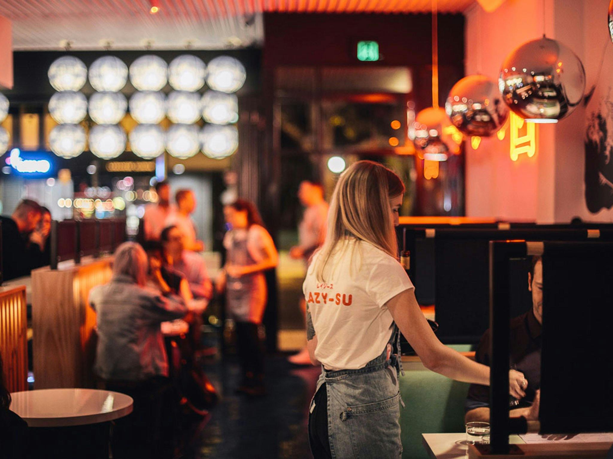 Restaurant interior at night filled with diners