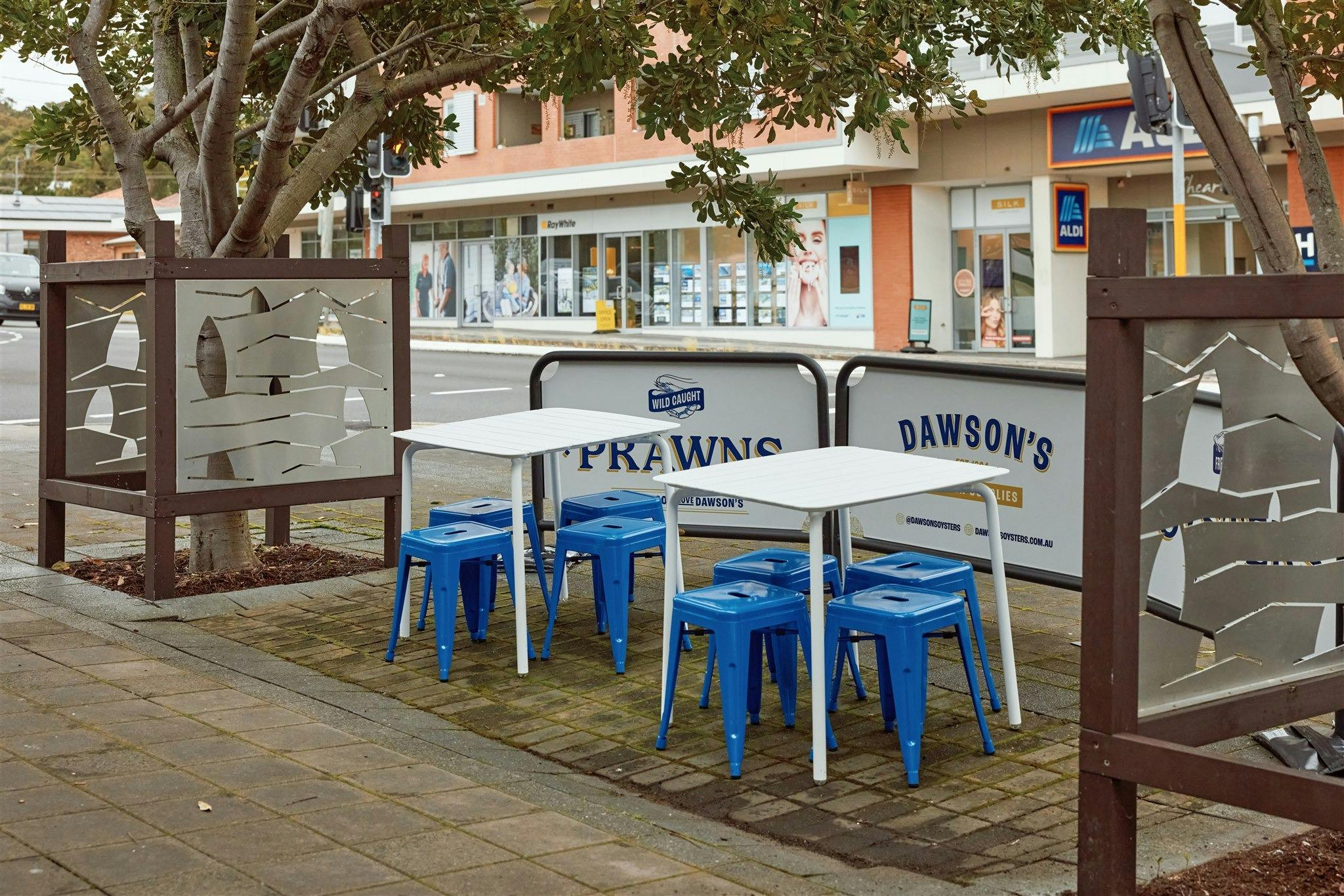 White tables and blue chairs