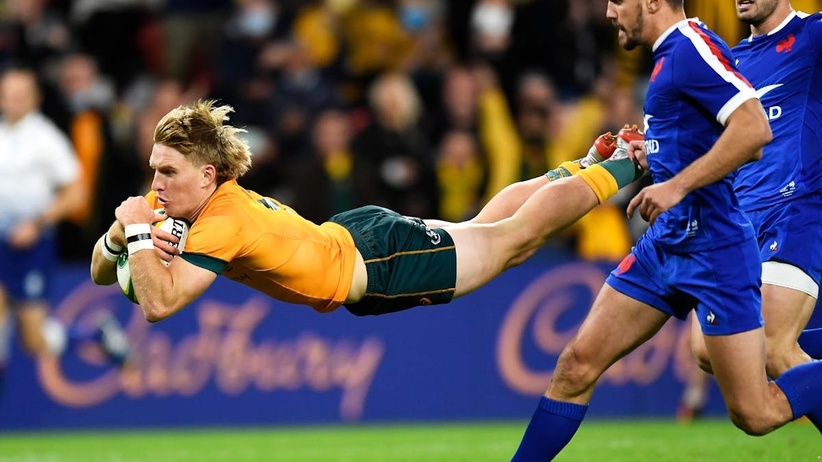 Tate McDermott diving with the ball for the Wallabies