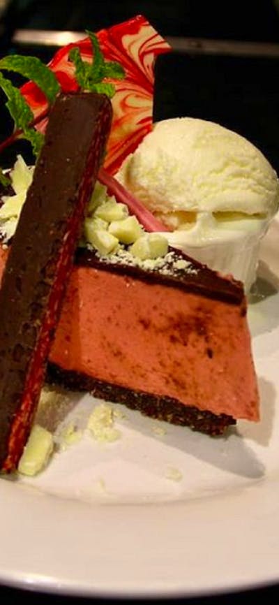 Dessert at the Royal Hotel Adelong, picture is a chocolate cherry cheesecake, served with ice cream