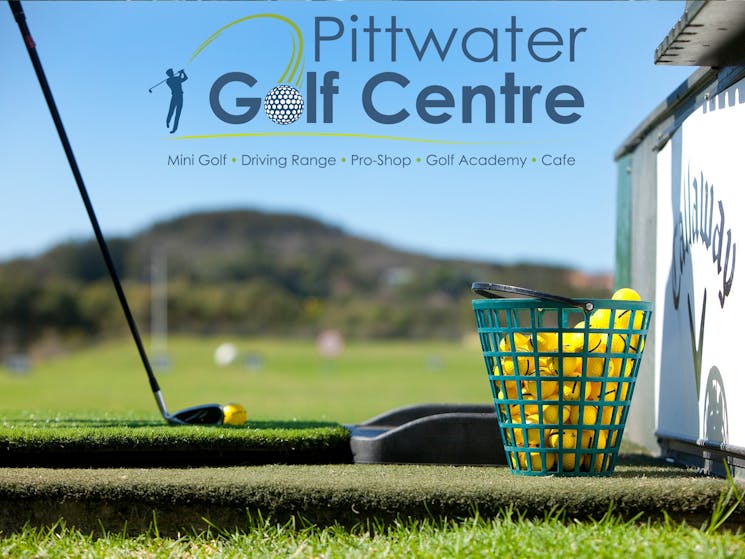 Pittwater Golf Centre - Driving Range - Bucket of balls and ball ready to be hit into the horizon