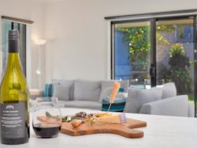 kitchen bench with wine and cheese