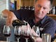 Man pours wine with a paired wine and olive tasting in Rutherglen