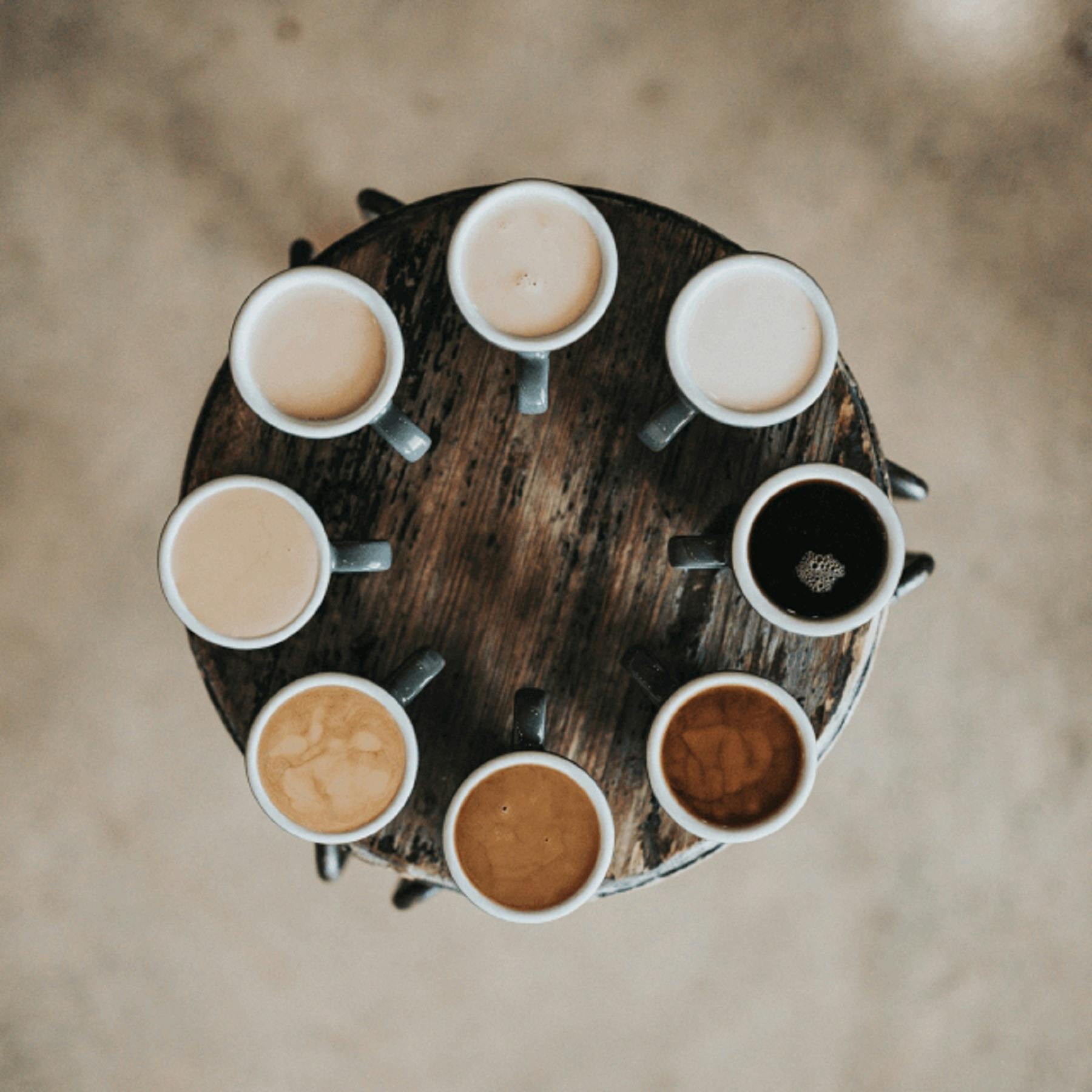 Circle of different coloured coffees