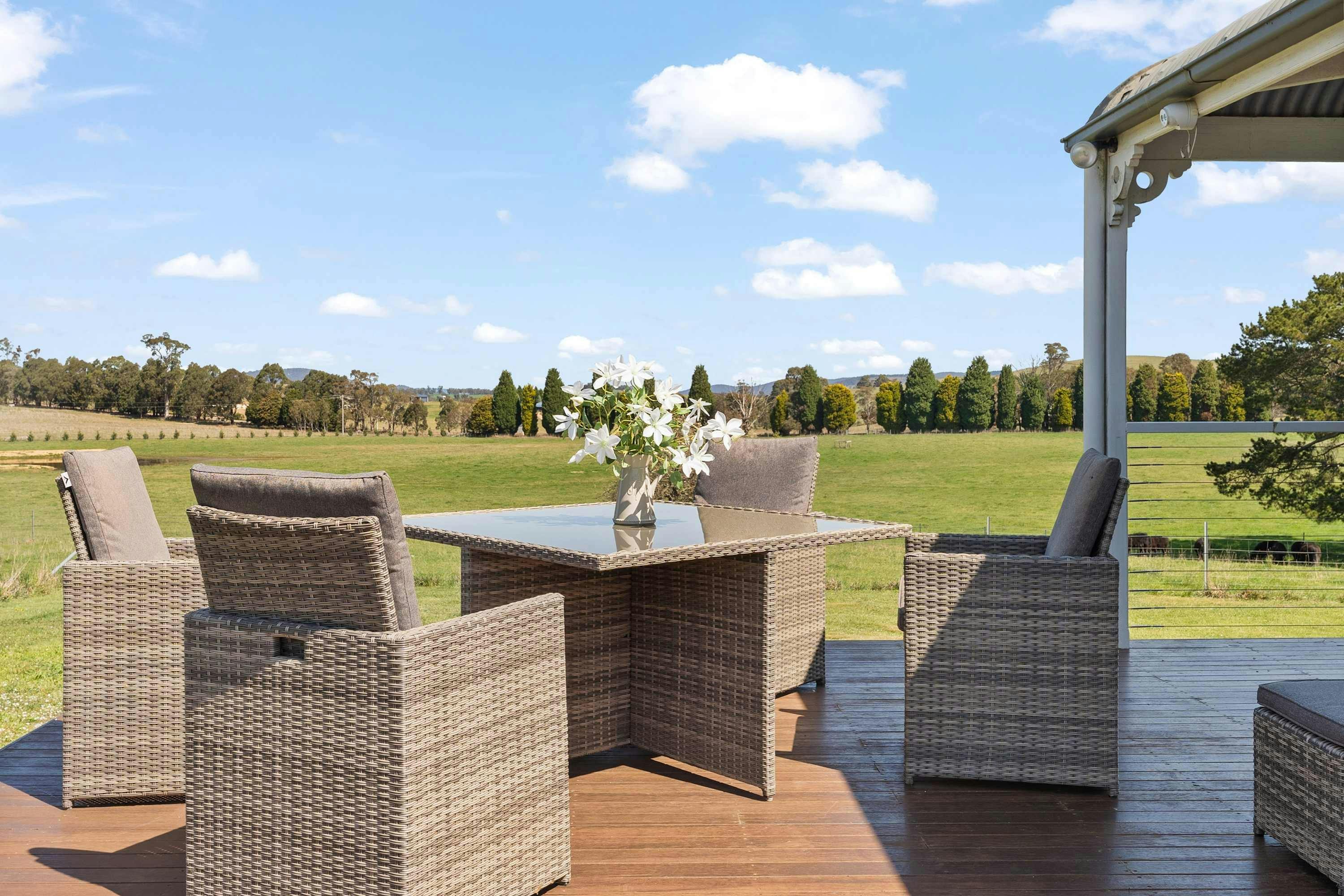 4 outdoor armchairs with a table and an amazing view