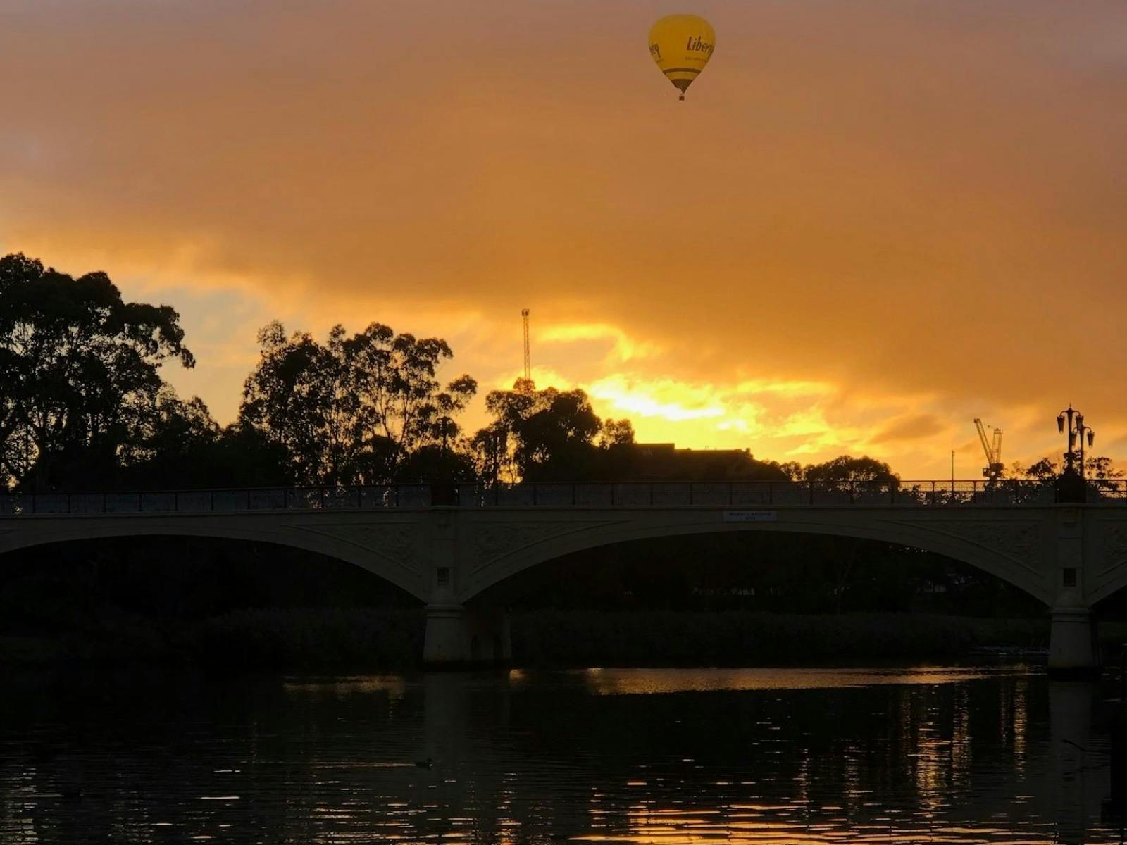 Hot air balloon adventure capturing the river reflection in Geelong.