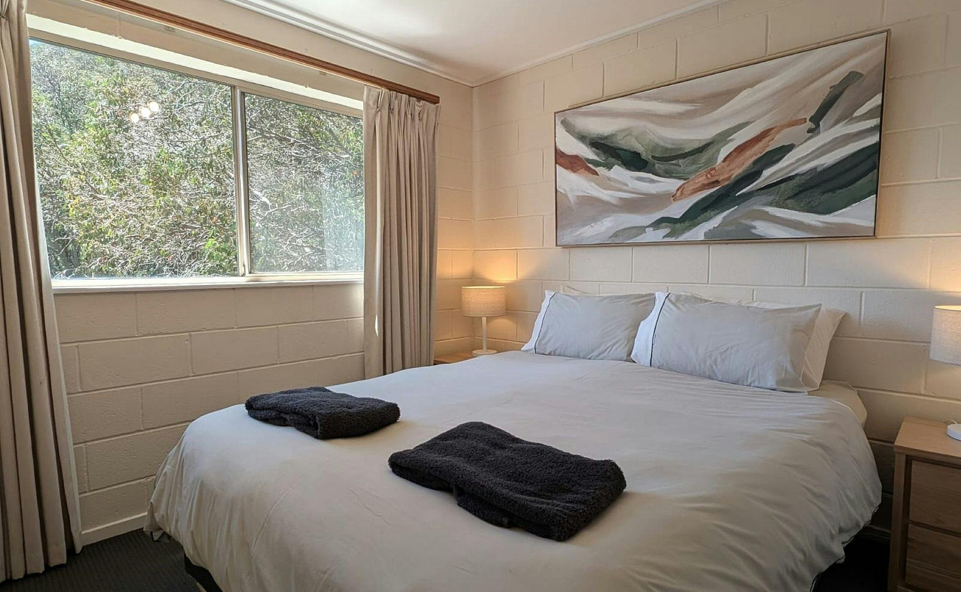 Bedroom with bedside tables and lamps