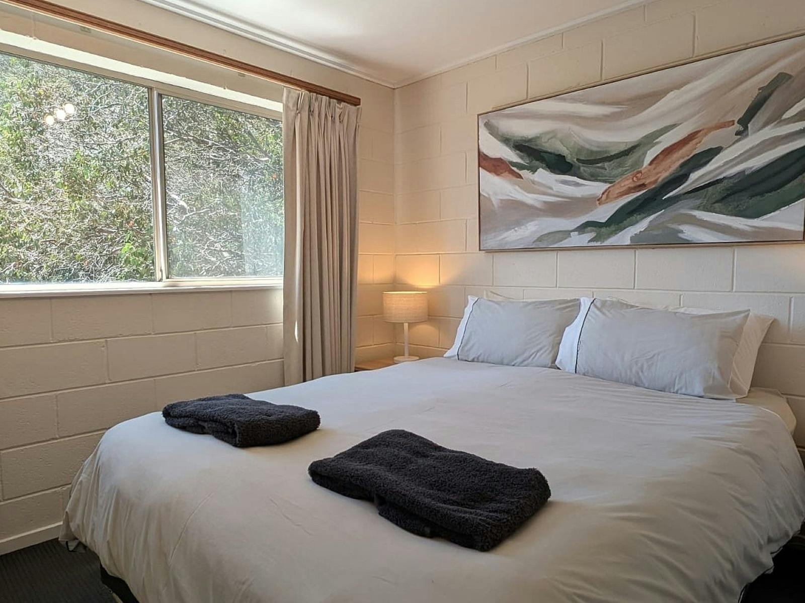 Bedroom with bedside tables and lamps