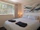 Bedroom with bedside tables and lamps
