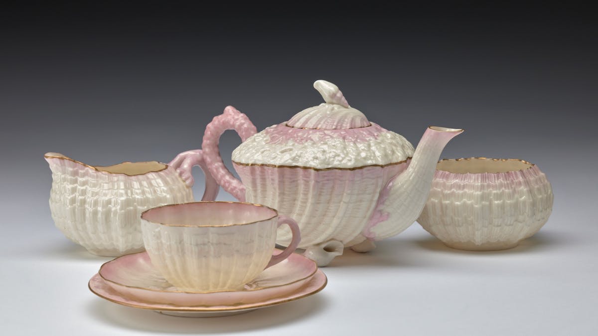 Delicate tea set with ornate cream and pale pink detail