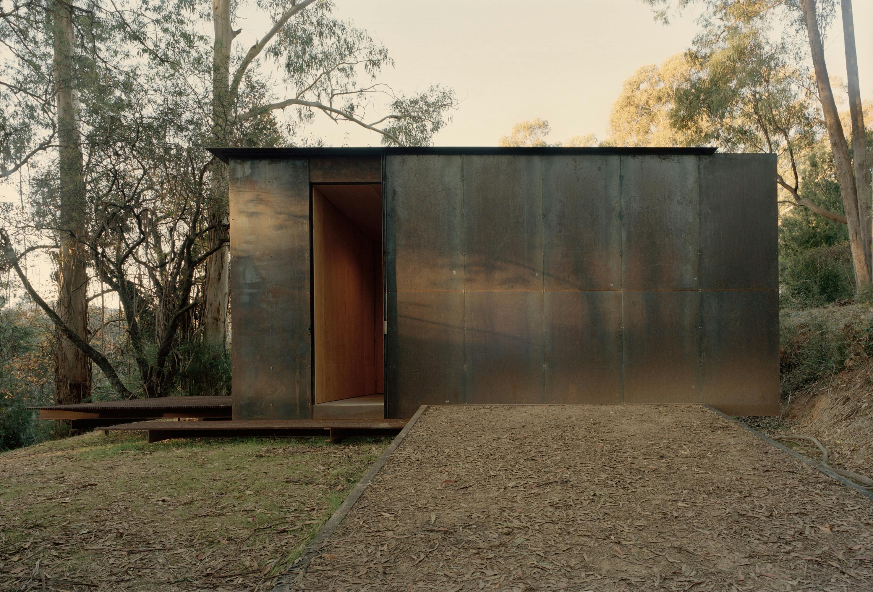 The Barn has two stunning steel roller doors, that beautifully play with the gums shadows