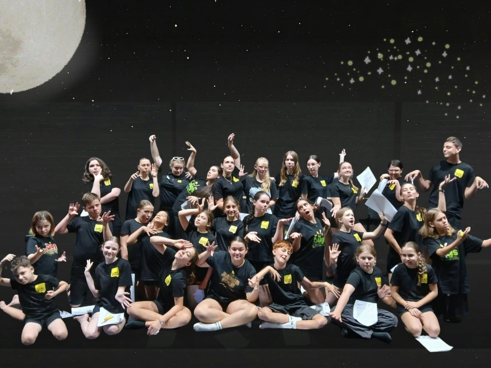 A large group of drama students