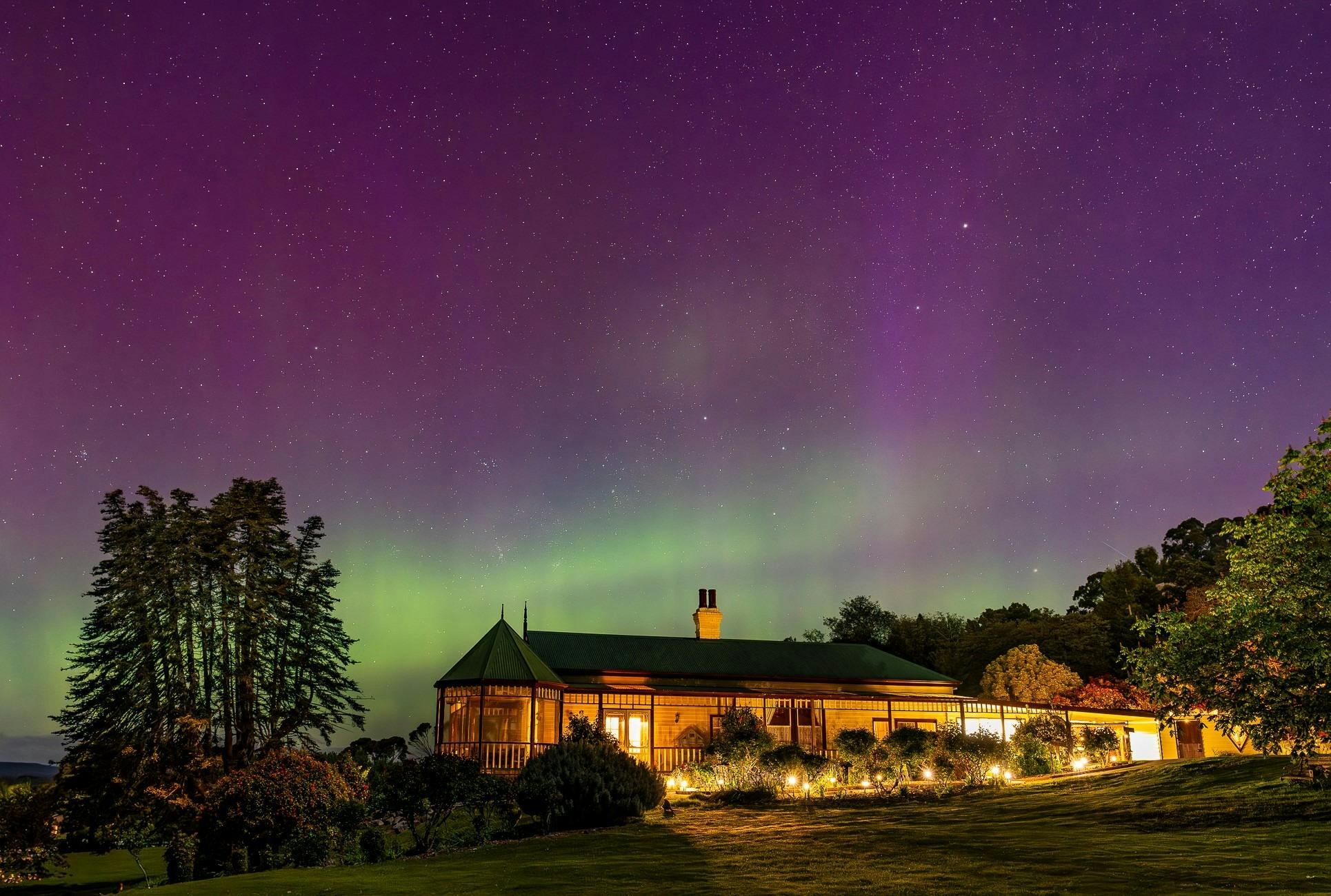 A heritage home against the backdrop of Southern lights in Beauty Point, Tasmania
