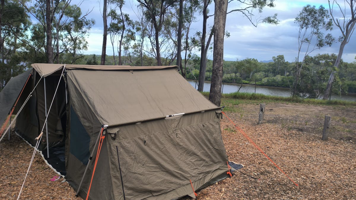 Safari tagalong tent with baffle creek in the background