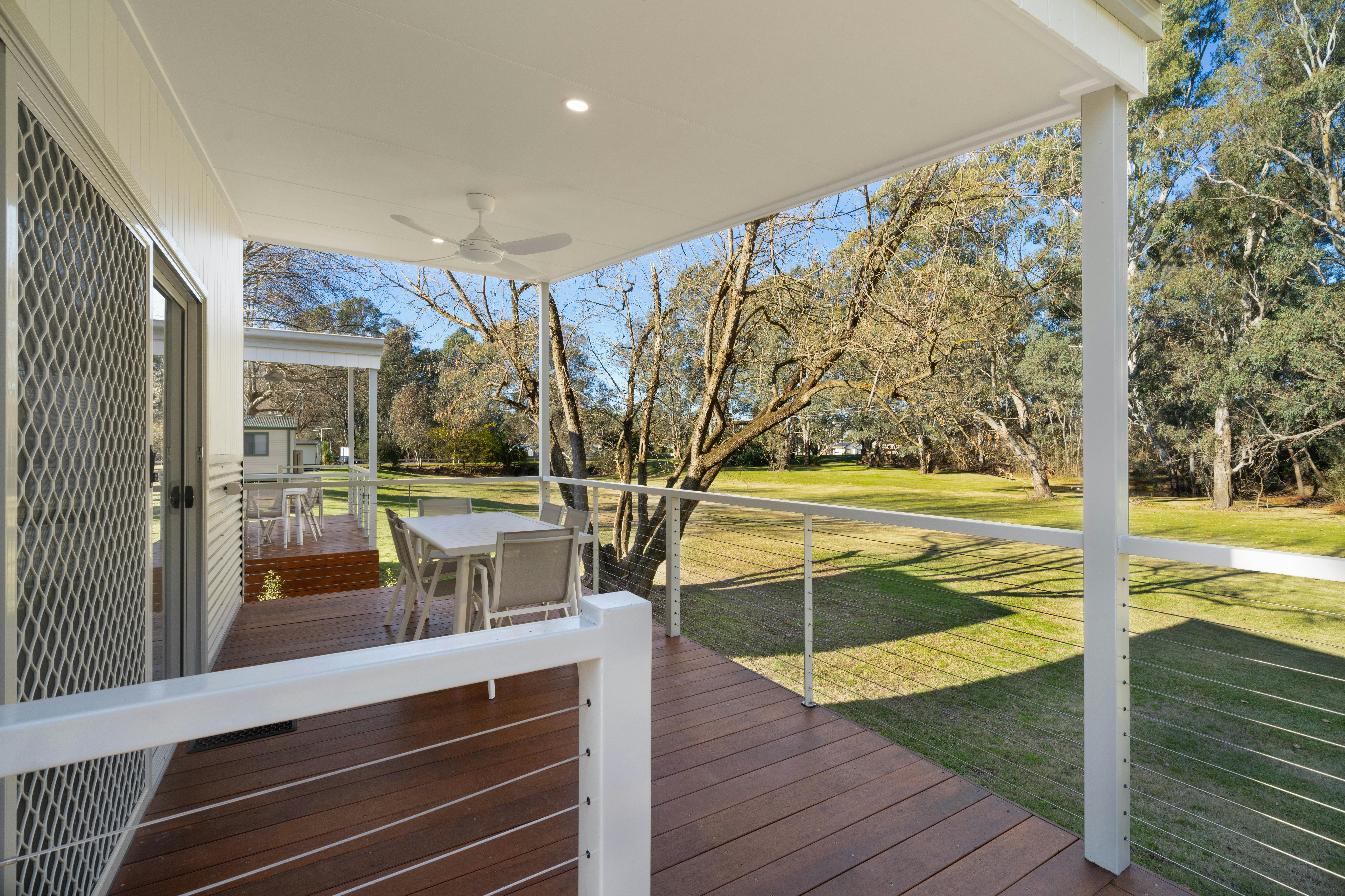 Premium family cabin showing large deck and ramp access