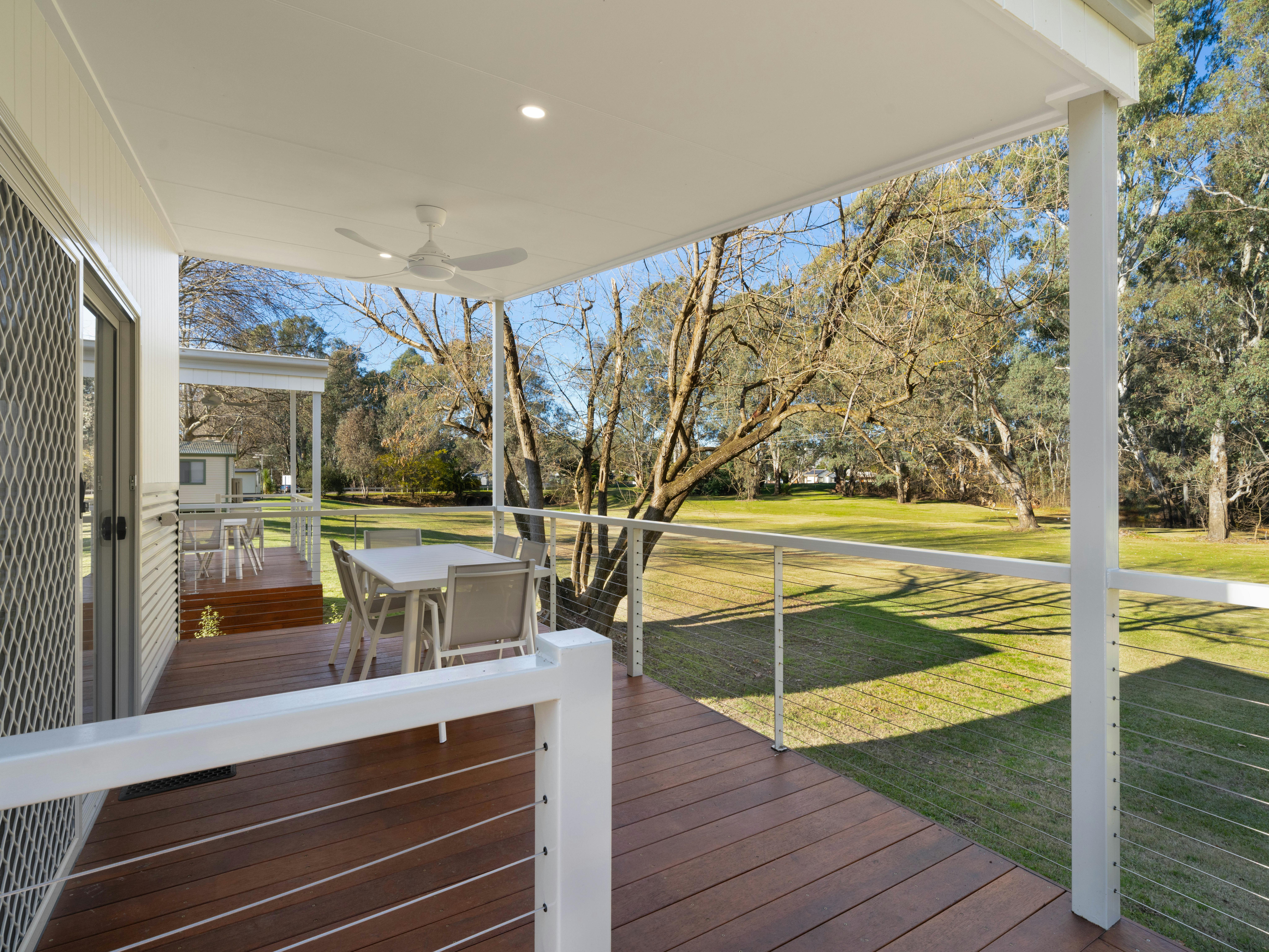 Premium family cabin showing large deck and ramp access