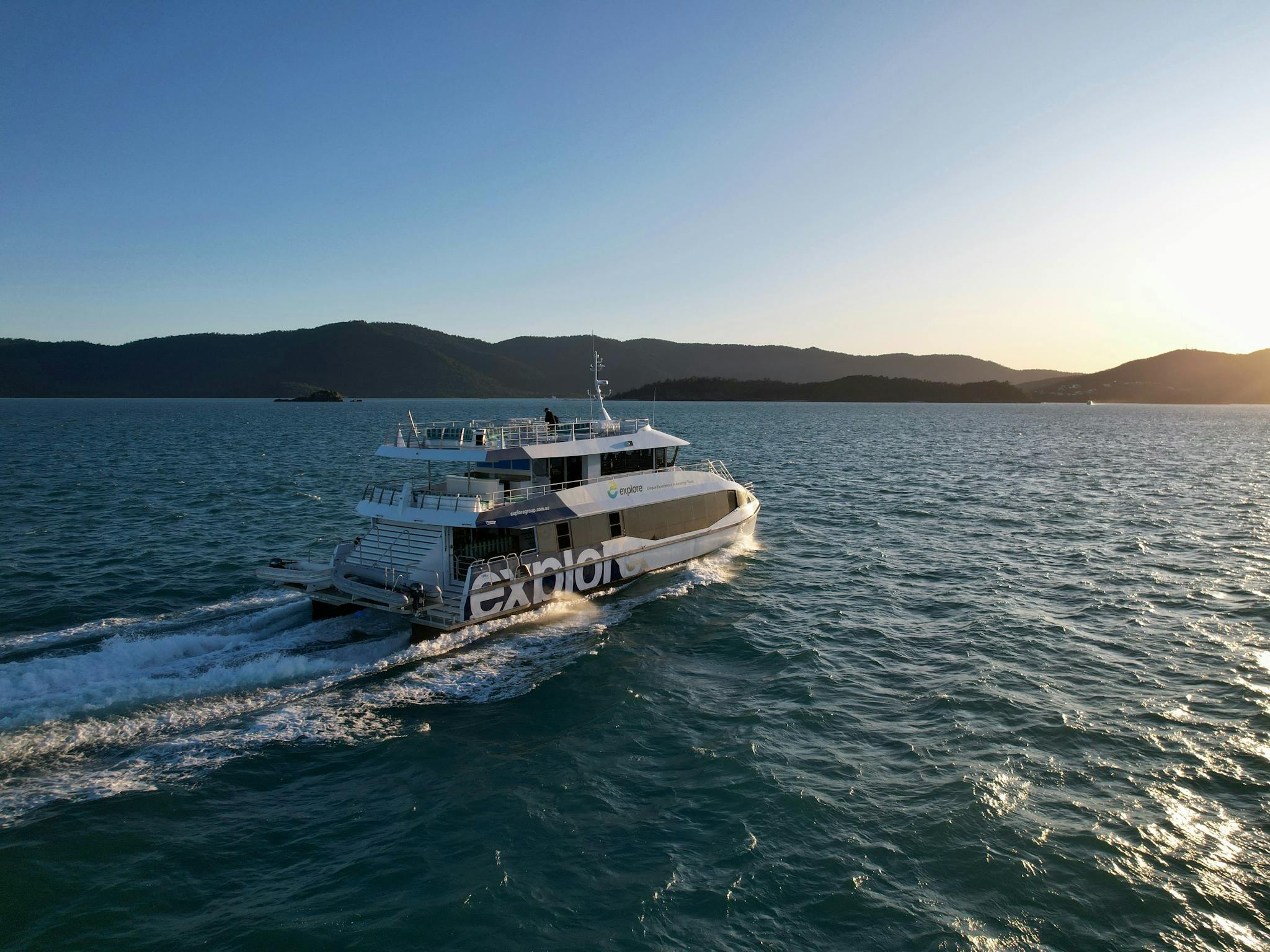 Ocean Explorer heading off at sunset Ocean Explorer heading off at sunset