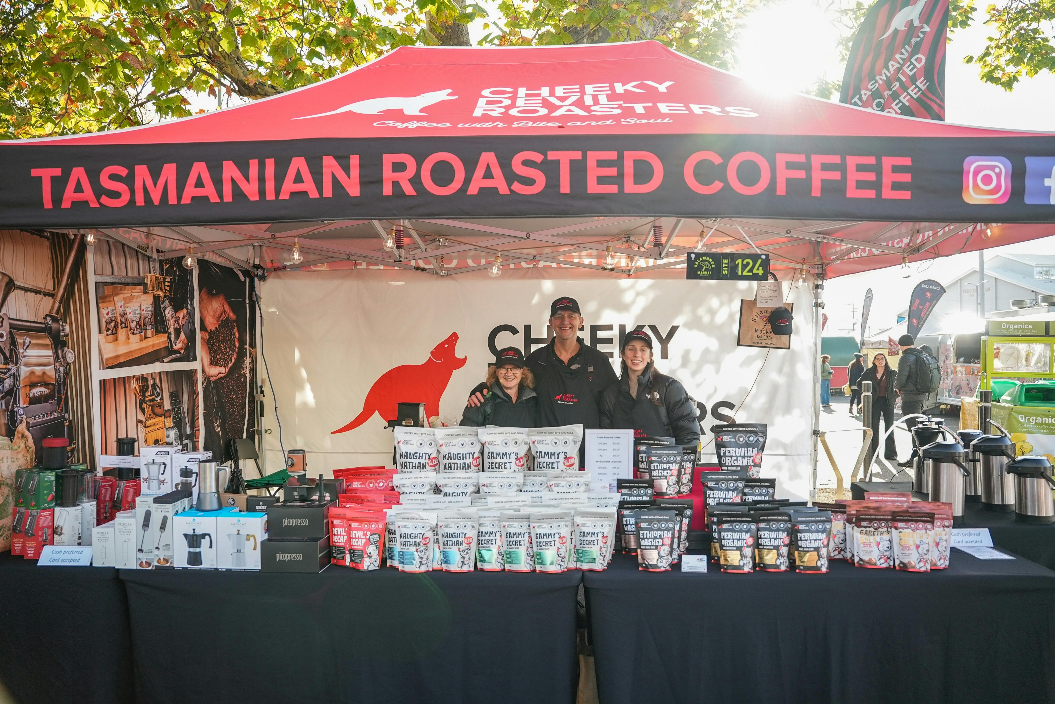 Cheeky Devil Coffee Roasters stall displaying Tasmanian roasted coffee at Salamanca Market.