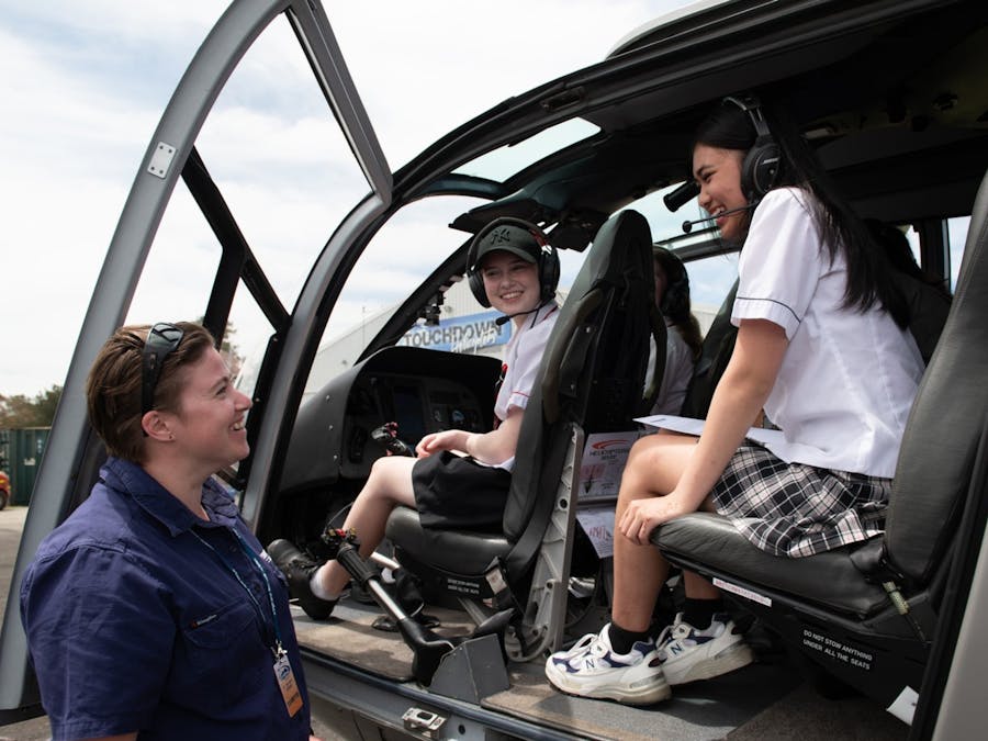 STEM Program - Students sitting in a helicopter