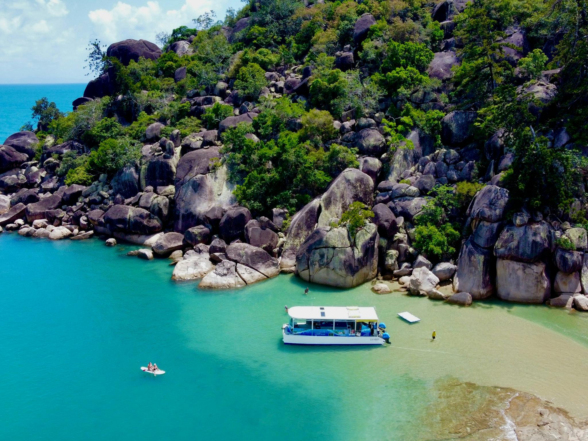 Aquascene Magnetic Island snorkelling in water at beach location with boat nearby with sun shining. Aquascene Magnetic Island snorkelling in water at beach location with boat nearby with sun shining.