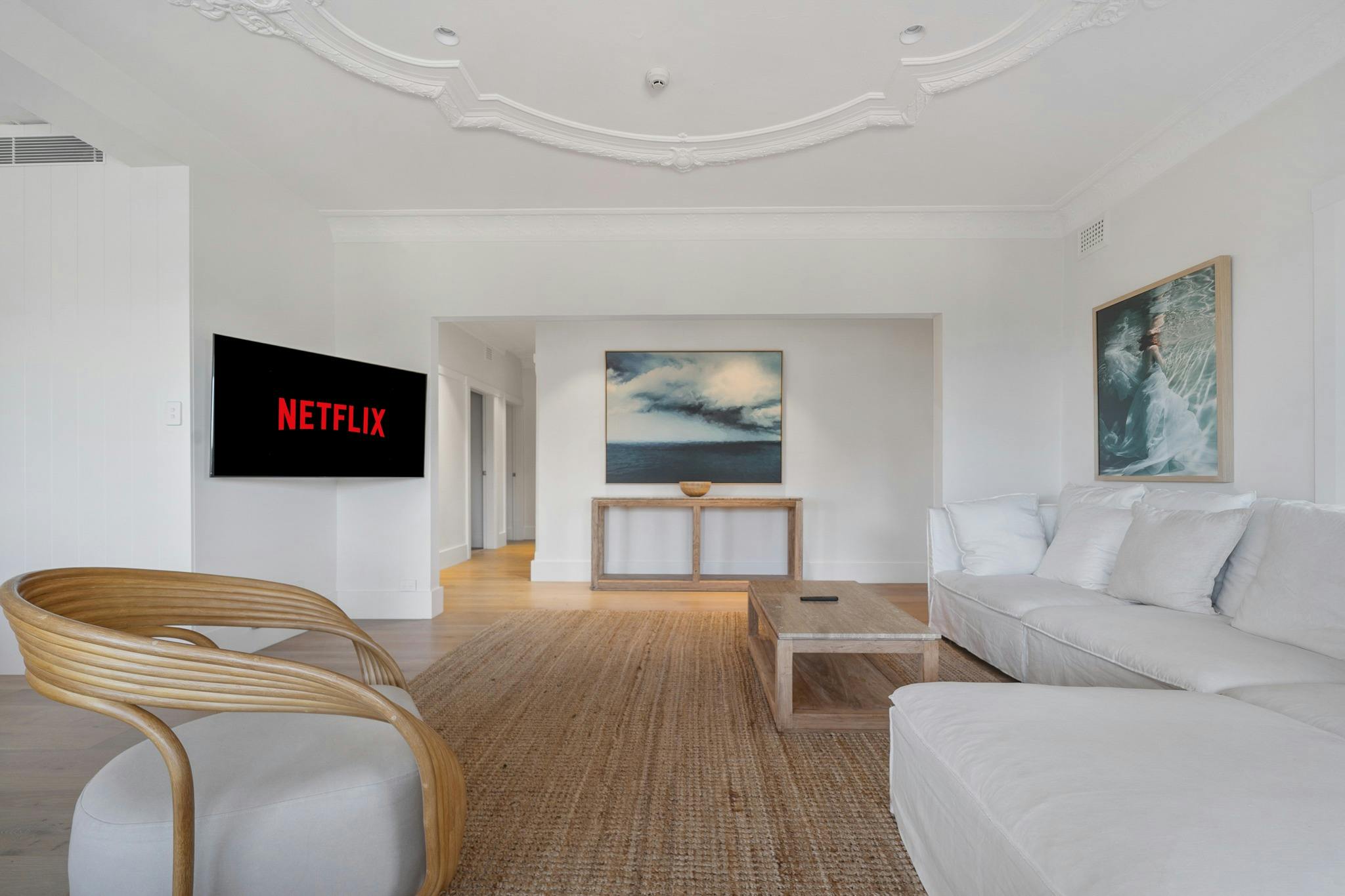 Spacious and stylish living area with comfortable furniture.