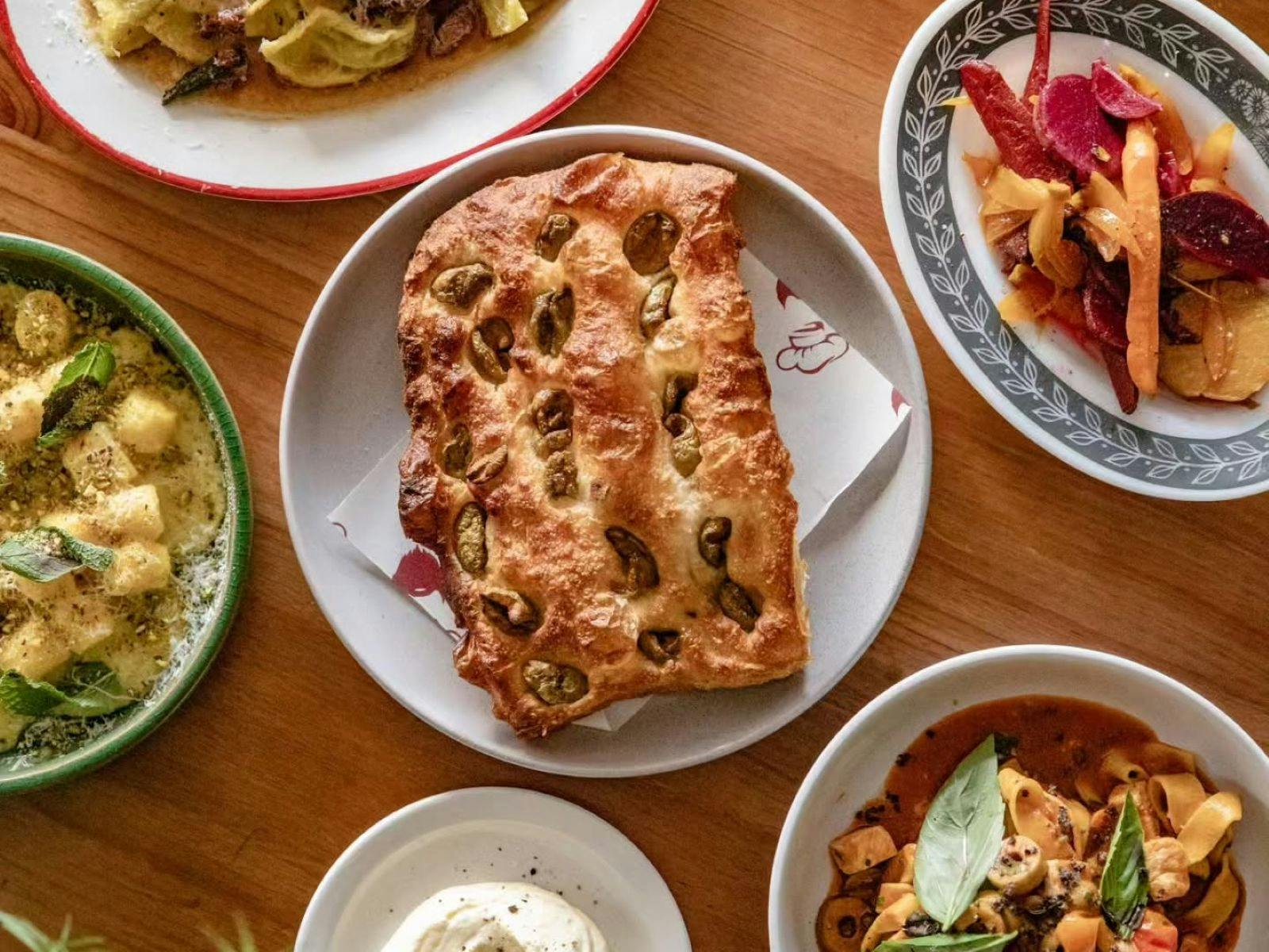 plates of delicious food on a timber table