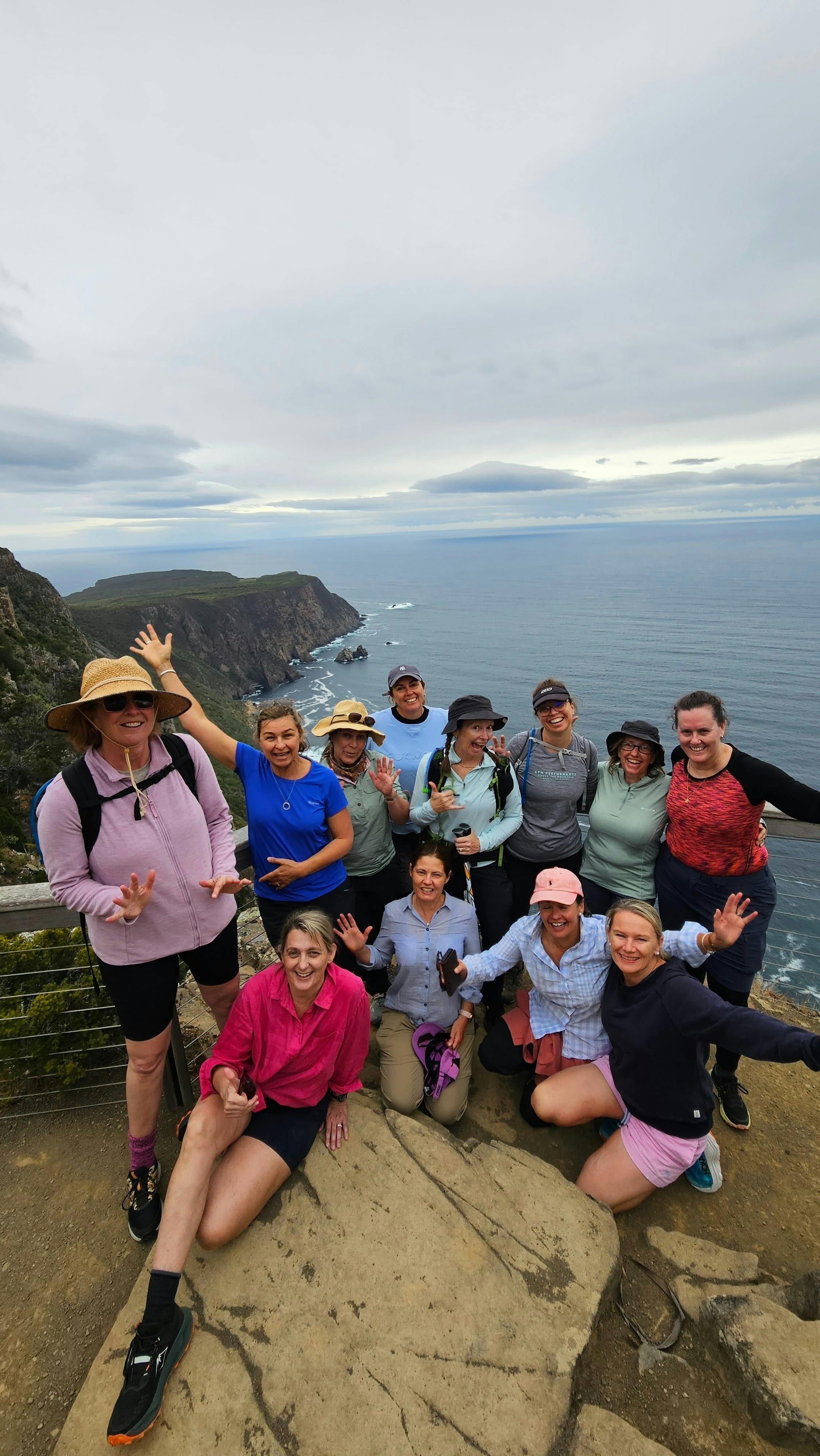 Guests enjoying a group photo on the Three Capes Walk Tasmania pack free guided walk