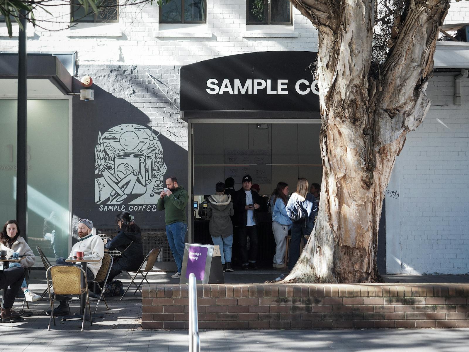 People drinking coffee in Sample Coffee Surry Hils.