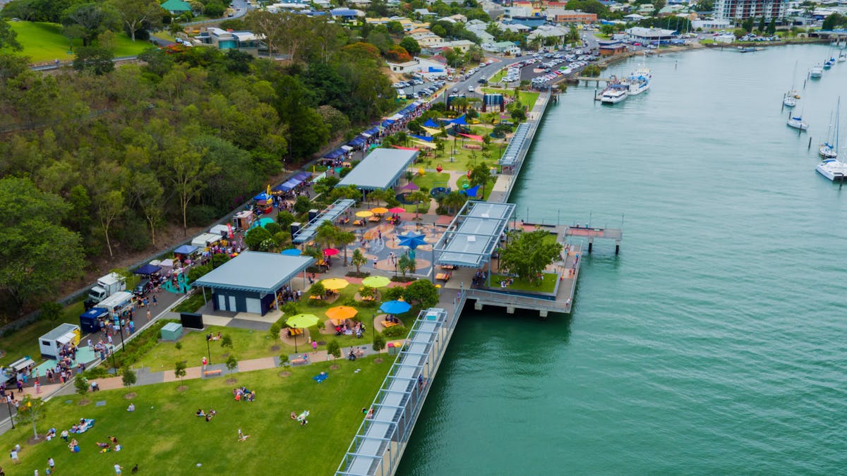 Ariel shot of the East Shores Parklands, showing green parklands, and blue water Ariel shot of the East Shores Parklands, showing green parklands, and blue water