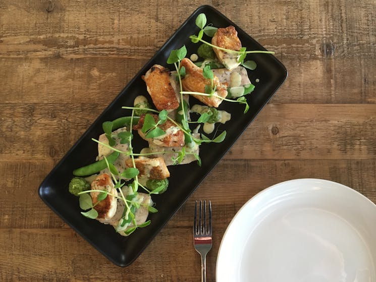 Rectangle plate with well presented meal from The Sir George at Jugiong