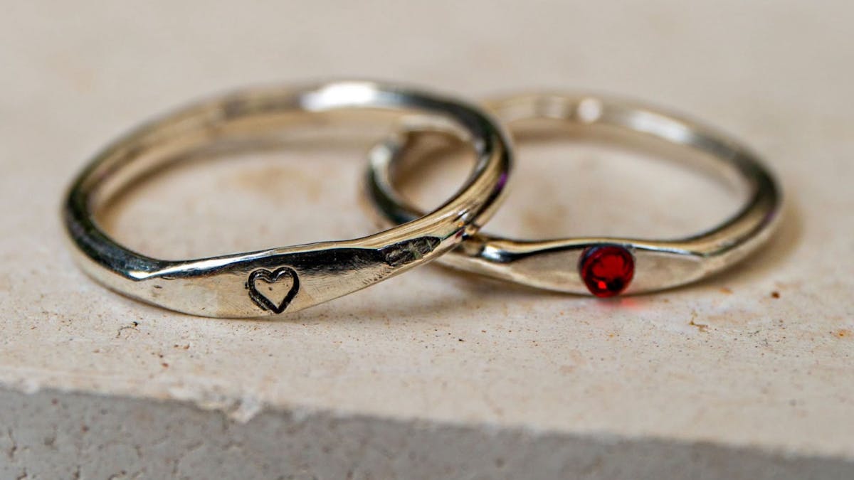 A dainty rounded silver ring, ready to be customised with a stamp or stone during the ring-making cl