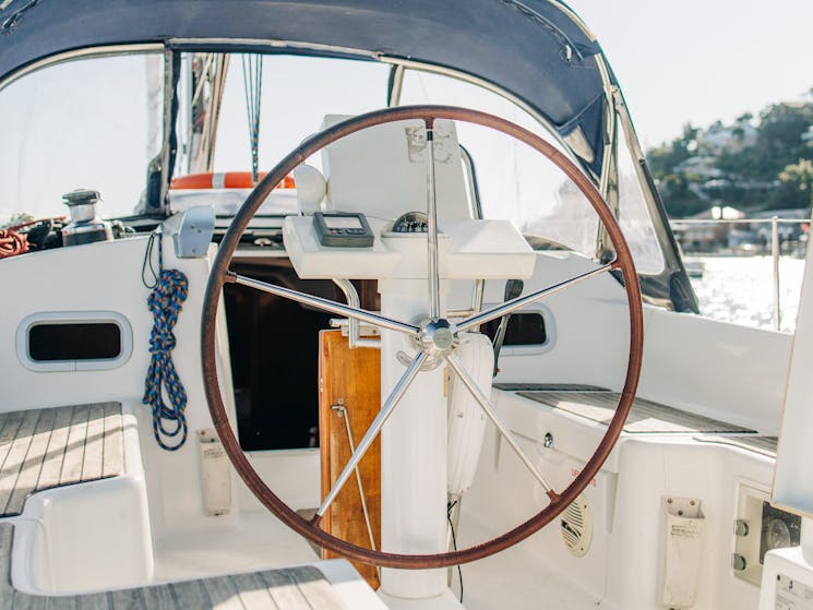 Boat cockpit and steering wheel moored in Palm Beach