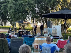 image of group of people watching 2 comedians on stage