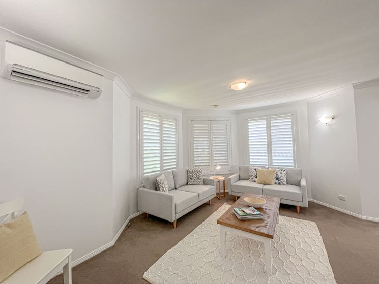 Comfortable lounge with air condition in Ebbtide at Caves Beach