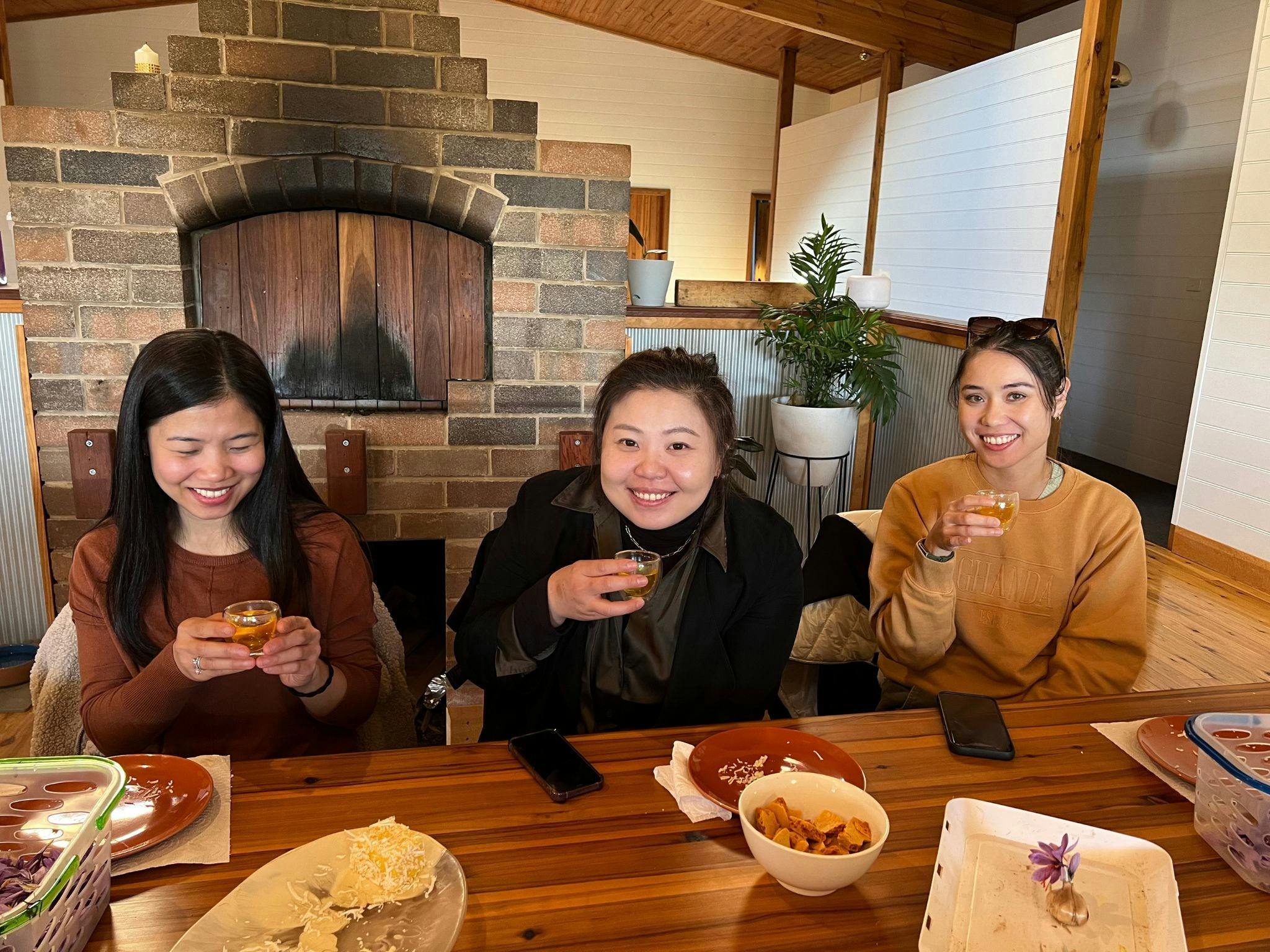 3 ladies drinking saffron tea on the saffron trail tour in Orange
